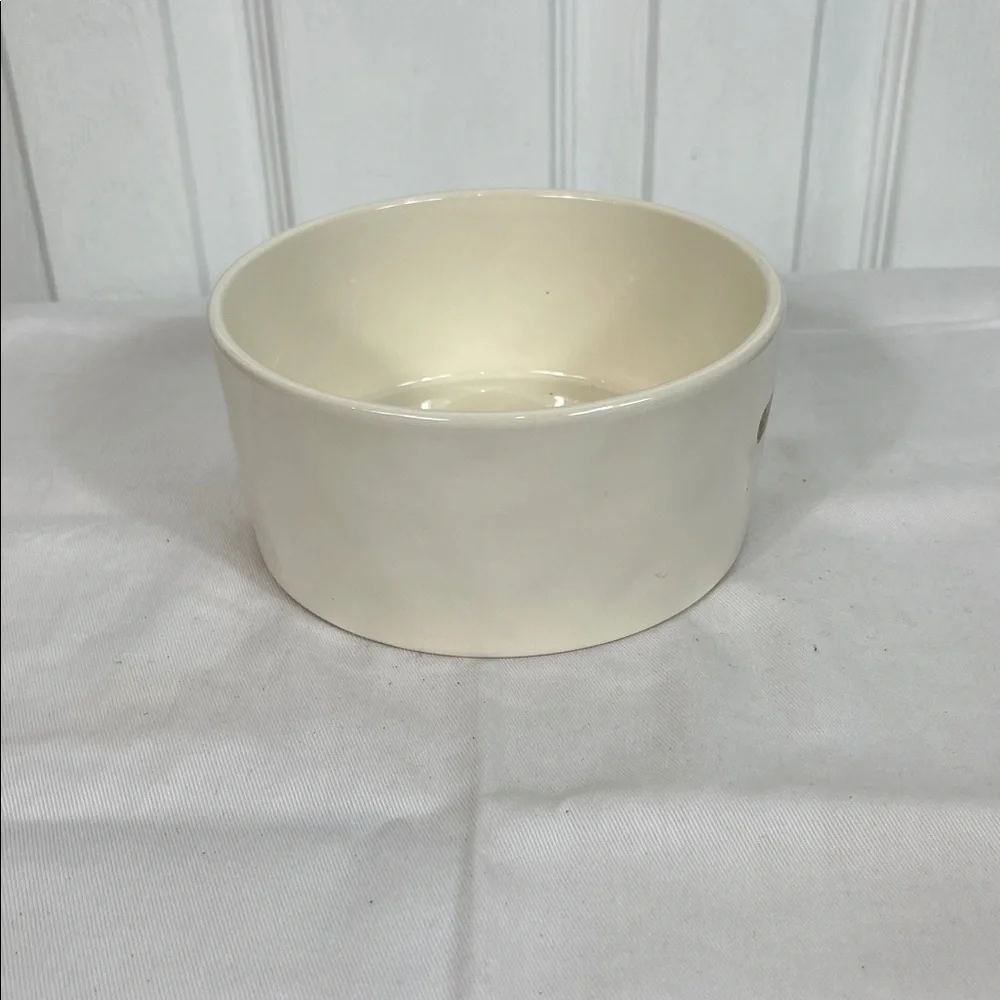 NWOT Rae Dunn white dog bowl 6”wide, 3”tall. Stick on front, WOOF inside bottom